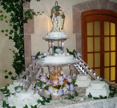  oldfashioned Italian wedding cake with lights and fountains and doves